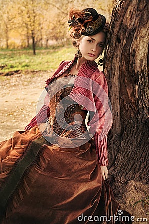 Portrait of romantic girl in historical dress. Stock Photo