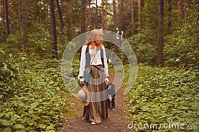 Portrait of romantic hippie woman smile in the woods. Stock Photo