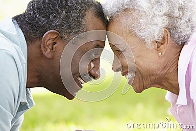 Portrait Of Romantic Senior African American Couple In Park Stock Photo