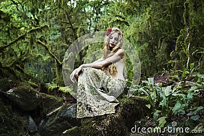 Portrait of romantic woman in fairy forest Stock Photo