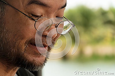 Portrait of 40s Asian mature adult beard man with eyeglasses Stock Photo