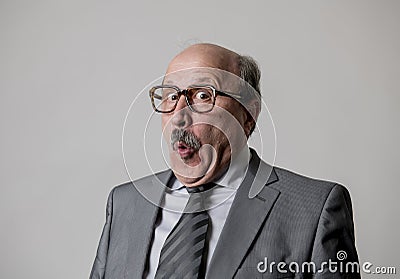 Portrait of 60s bald senior happy business man gesturing funny and comic in laughter and fun face expression looking happy Stock Photo