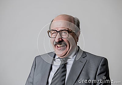 Portrait of 60s bald senior happy business man gesturing funny and comic in laughter and fun face expression looking happy Stock Photo