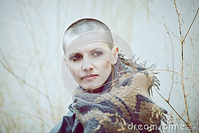 Portrait of sad beautiful Caucasian white young bald girl woman with shaved hair head in leather jacket Stock Photo