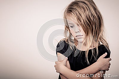 Portrait of sad blond little girl Stock Photo