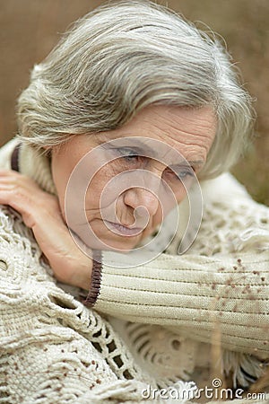 Portrait of sad eldery woman Stock Photo