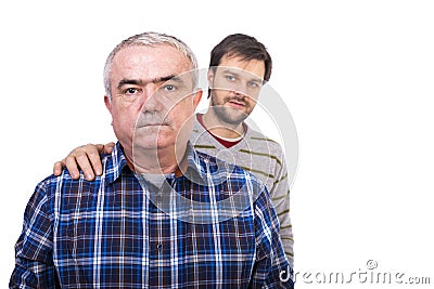 Portrait of sad senior man being comforted by his son Stock Photo