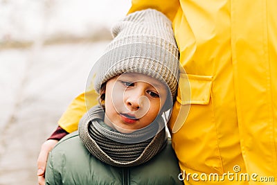 Portrait of sad son with father stand on the shore of the lake and hold hands. Happy family with child kid boy playing Stock Photo