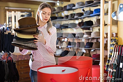 Saleswoman preparing hats in boxes for sale Stock Photo