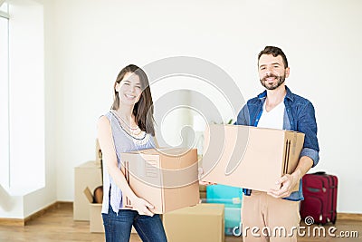 Satisfied Couple Carrying Corrugated Boxes While Moving To New H Stock Photo