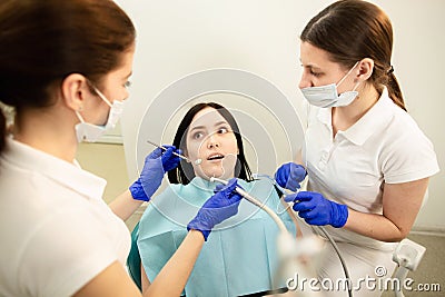 Portrait of a scared woman during dental examination Stock Photo