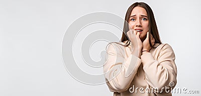 Portrait of the scared woman with long chestnut hair. Place for ad Stock Photo