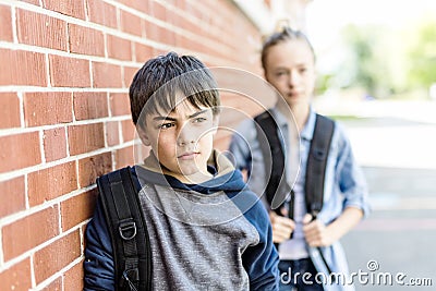 Portrait of school 10 years boy and girl having fun outside Stock Photo