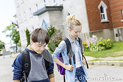 Portrait of school 10 years boy and girl having fun outside Stock Photo