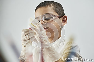 Portrait of schoolboy doing homework Stock Photo