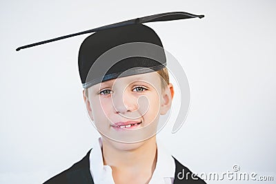 Portrait of schoolkid pretending to be graduate Stock Photo