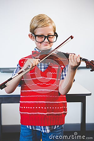 Portrait of schoolkid pretending to be music teacher Stock Photo