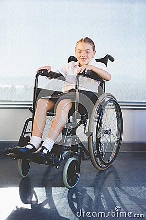 Portrait of schoolkid sitting on wheelchair Stock Photo