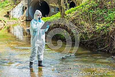portrait of a scientist in sewer water Stock Photo