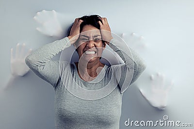 Portrait, screaming and senior woman with anxiety, depression and trauma with mental health. Angry face, female person Stock Photo