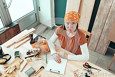 Portrait of self employed female carpenter in her woodwork workshop Stock Photo