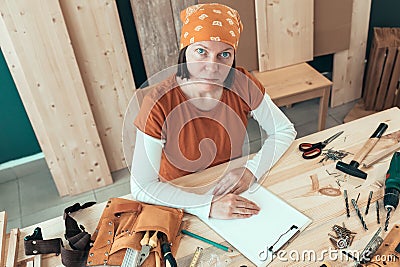 Portrait of self employed female carpenter in her woodwork workshop Stock Photo
