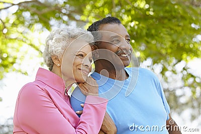 Portrait Of Senior African American Couple Wearing Running Clothing In Park Stock Photo