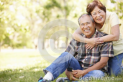 Portrait senior Asian couple in park Stock Photo