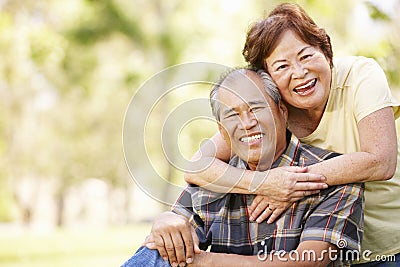 Portrait senior Asian couple in park Stock Photo