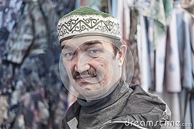 Portrait of senior Asian man wearing Kyrgyz headdress topu. Stock Photo