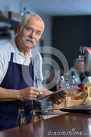 portrait senior barman at work Stock Photo