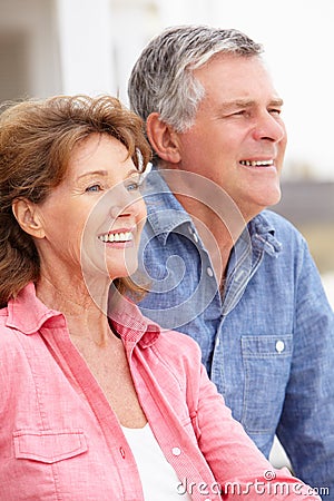 Portrait senior couple on beach Stock Photo