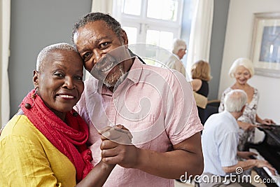 Portrait Of Senior Couple Enjoying Dancing Club Together Stock Photo