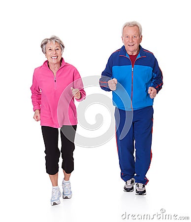 Portrait of senior couple jogging Stock Photo