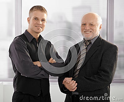 Portrait of senior and junior businessmen Stock Photo