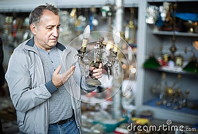 Portrait of senior male holding vintage souvenir Stock Photo