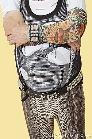 Midsection of senior male punk musician playing guitar Stock Photo