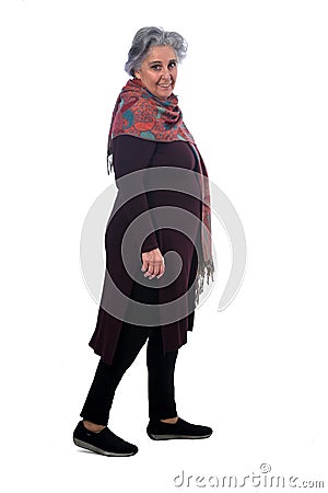 Portrait of a senir woman walking on white Stock Photo