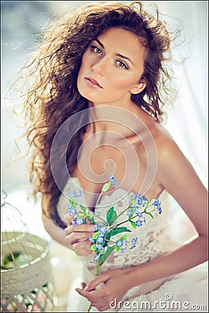 Portrait of a sensual kinky girl in a white dress with flowing h Stock Photo