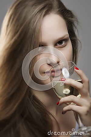 Portrait of sensual woman with long beautiful hair drinking glass of white wine Stock Photo