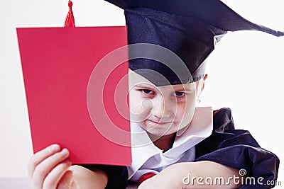 Portrait of serious child girl judge lawyer with red card as s Stock Photo