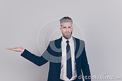 Portrait of serious handsome confident strict professional expert with red beard wearing black formal outfit dark blazer Stock Photo
