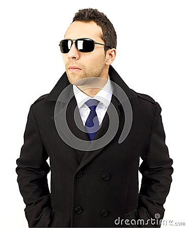 Portrait of a serious standing man with sunglasses Stock Photo