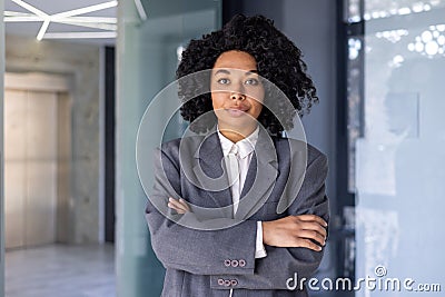 Portrait of serious successful African American business woman, boss in business suit looking focused at camera with Stock Photo