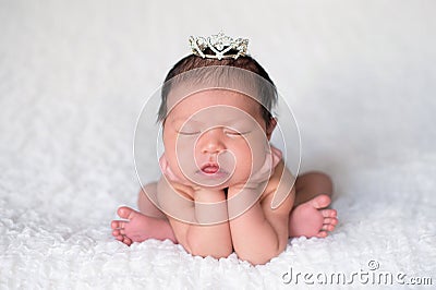 Newborn Baby Girl Wearing a Rhinestone Princess Crown Stock Photo