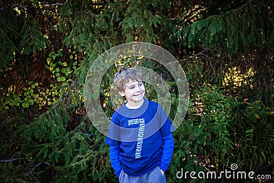 Portrait of Seven year old birthday boy wearing number 7 shirt Stock Photo