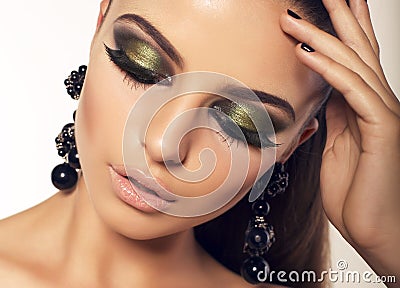 Portrait of beautiful brunette with smokey eyes makeup Stock Photo