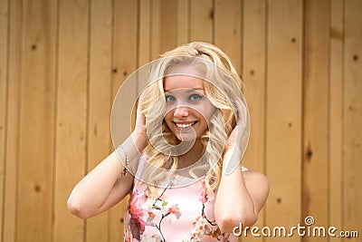 Portrait of a sexy young female blonde on a background of wooden boards Stock Photo