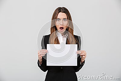 Portrait of a shocked businesswoman dressed in suit Stock Photo