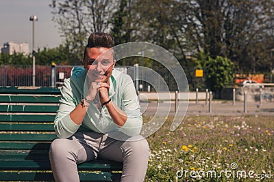 Portrait of a short hair girl sitting on bench Stock Photo